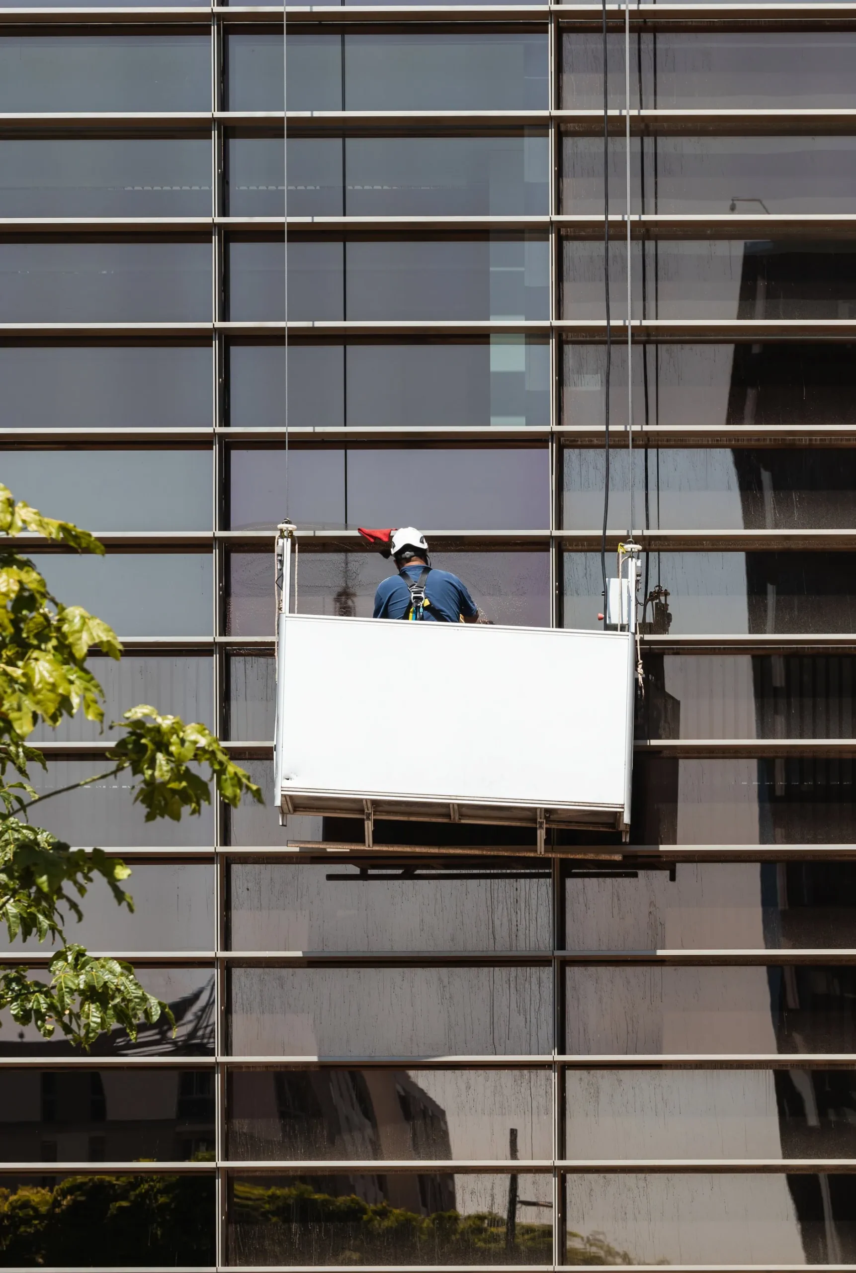 Commercial Window Cleaning in Cardiff - window washer cleaning high building