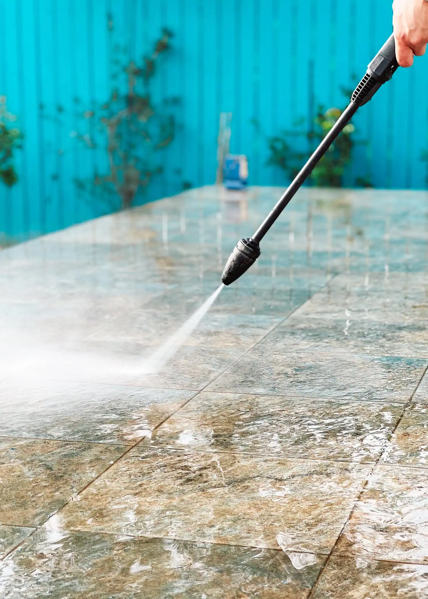 pressure washing patio tiles with power washer